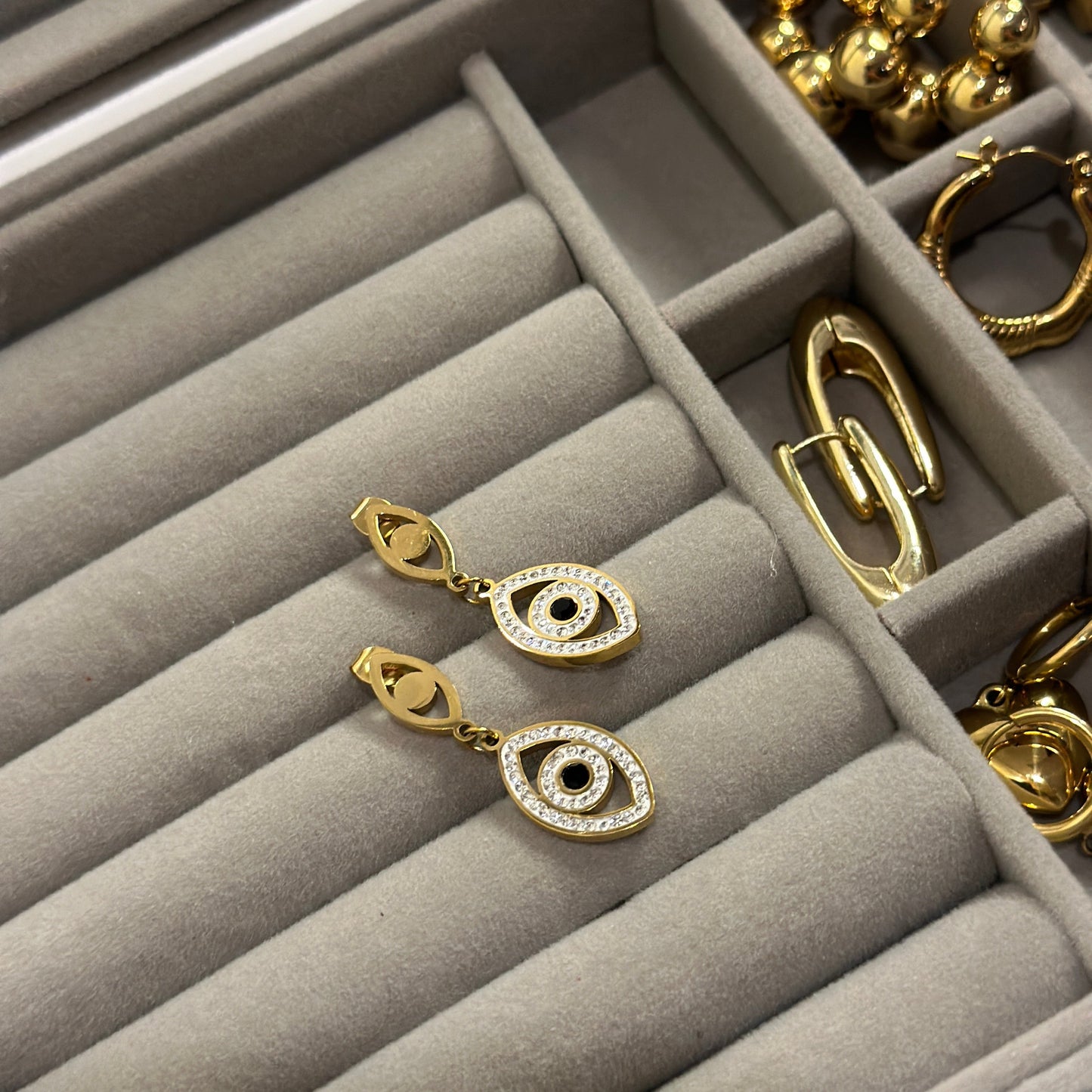 EVIL EYE DANGLING STUDS